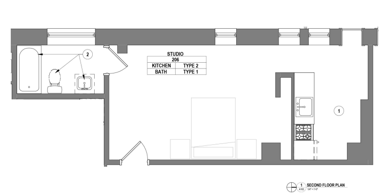Modern studio apartment floor plan featuring an open layout with kitchen and bathroom, perfect for efficient living space.