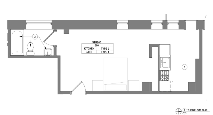 Modern studio floor plan on the third floor featuring a well-designed kitchen and bathroom, ideal for efficient urban living.
