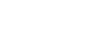 Sleek geometric building facade with large, grid-like windows and modern design.