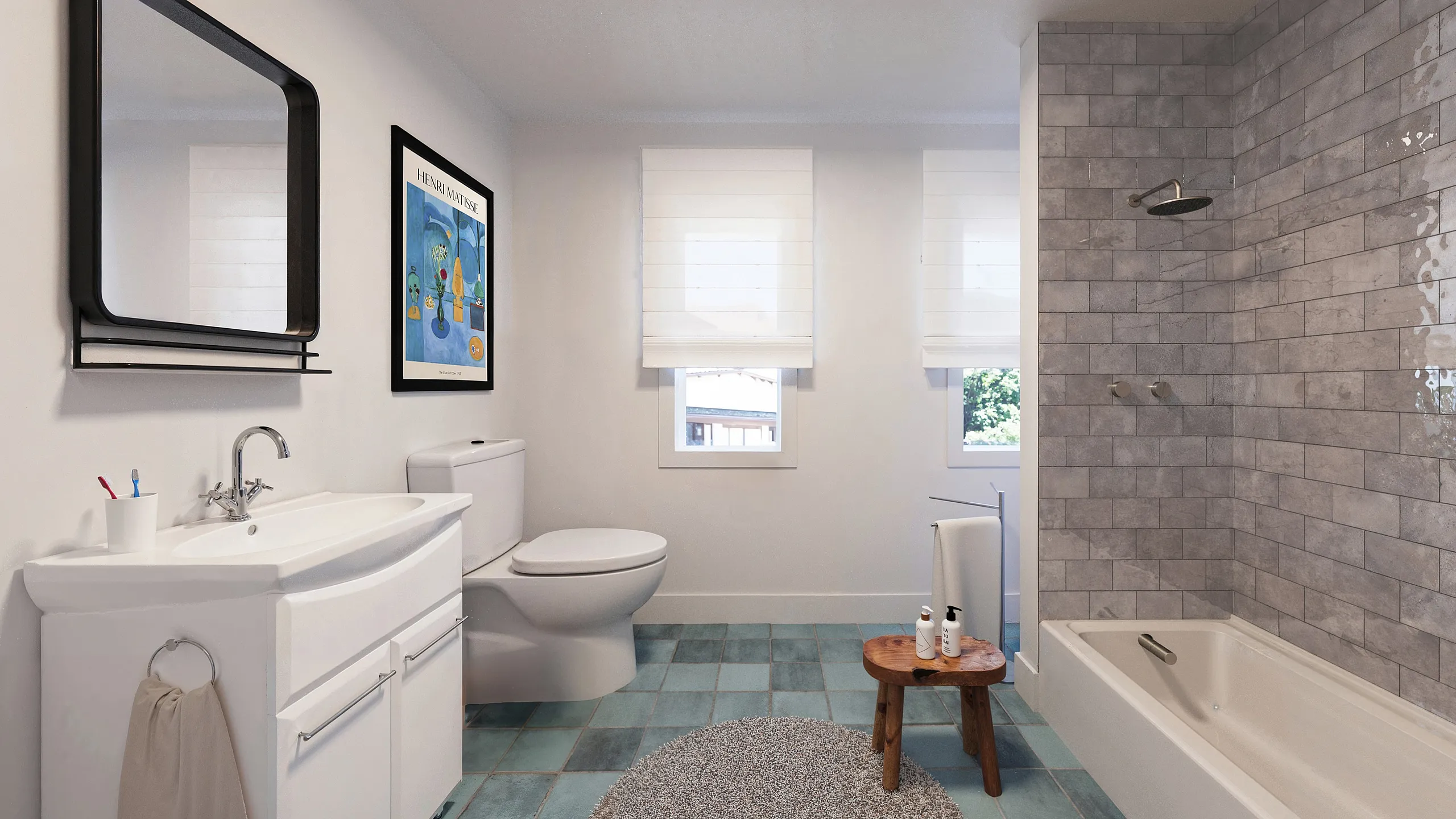 Modern bathroom with stylish gray tile shower, sleek white fixtures, and natural light through large windows.