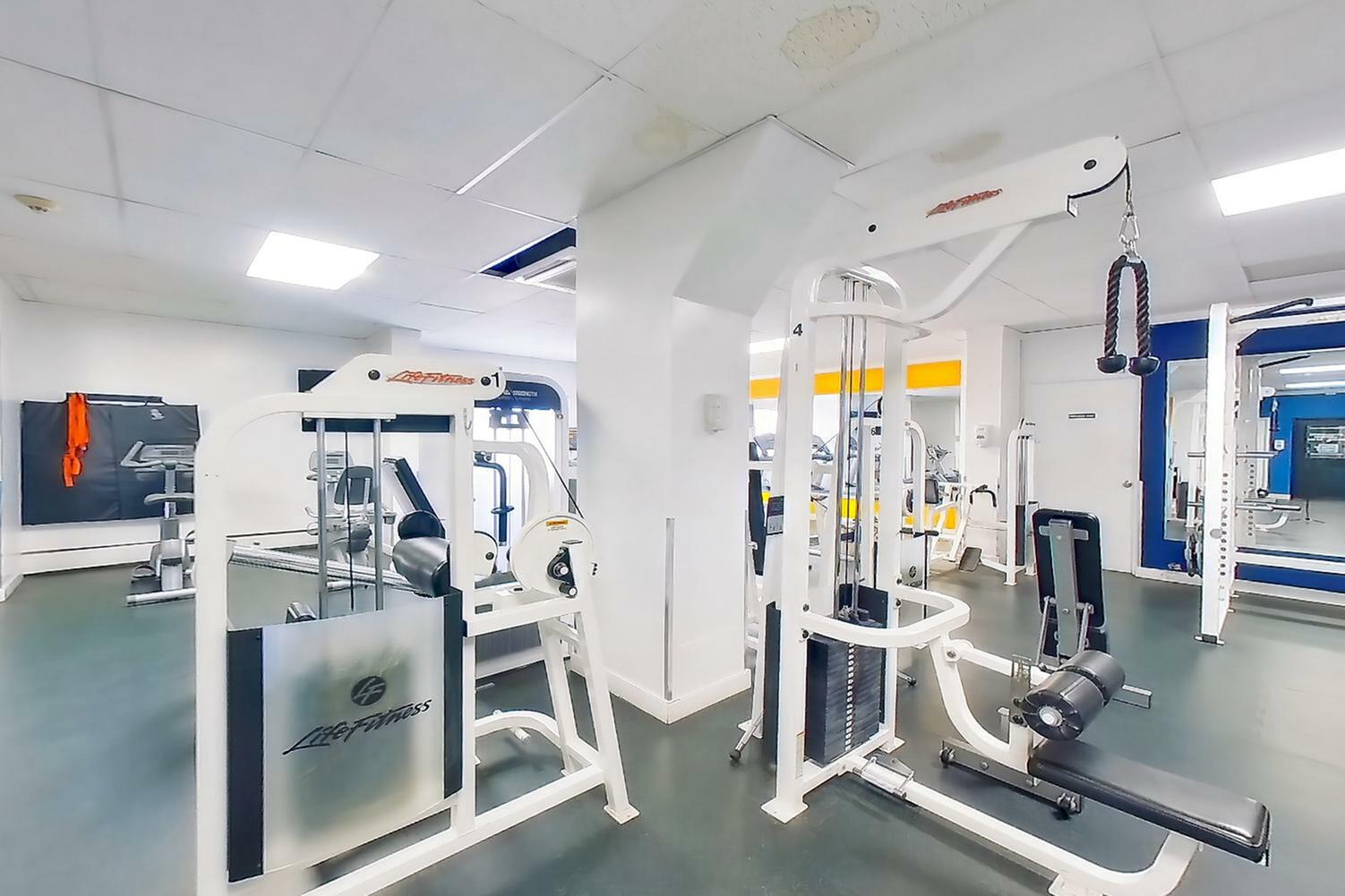 Bright and modern fitness center featuring state-of-the-art gym equipment, ideal for a healthy lifestyle.