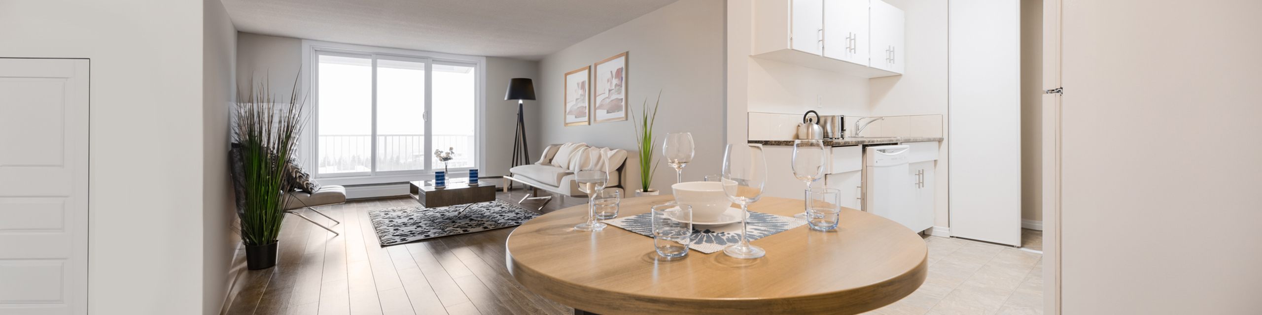 Bright and modern open-concept living space featuring large windows, elegant dining area, and contemporary kitchen design.