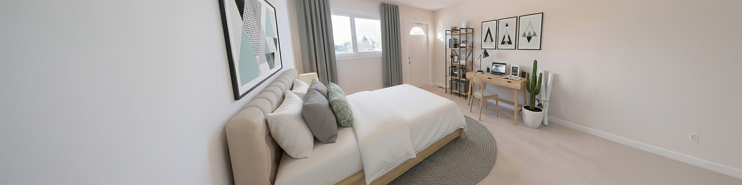 Bright and modern bedroom with plush bed, geometric wall art, spacious desk area, and natural light from large window.