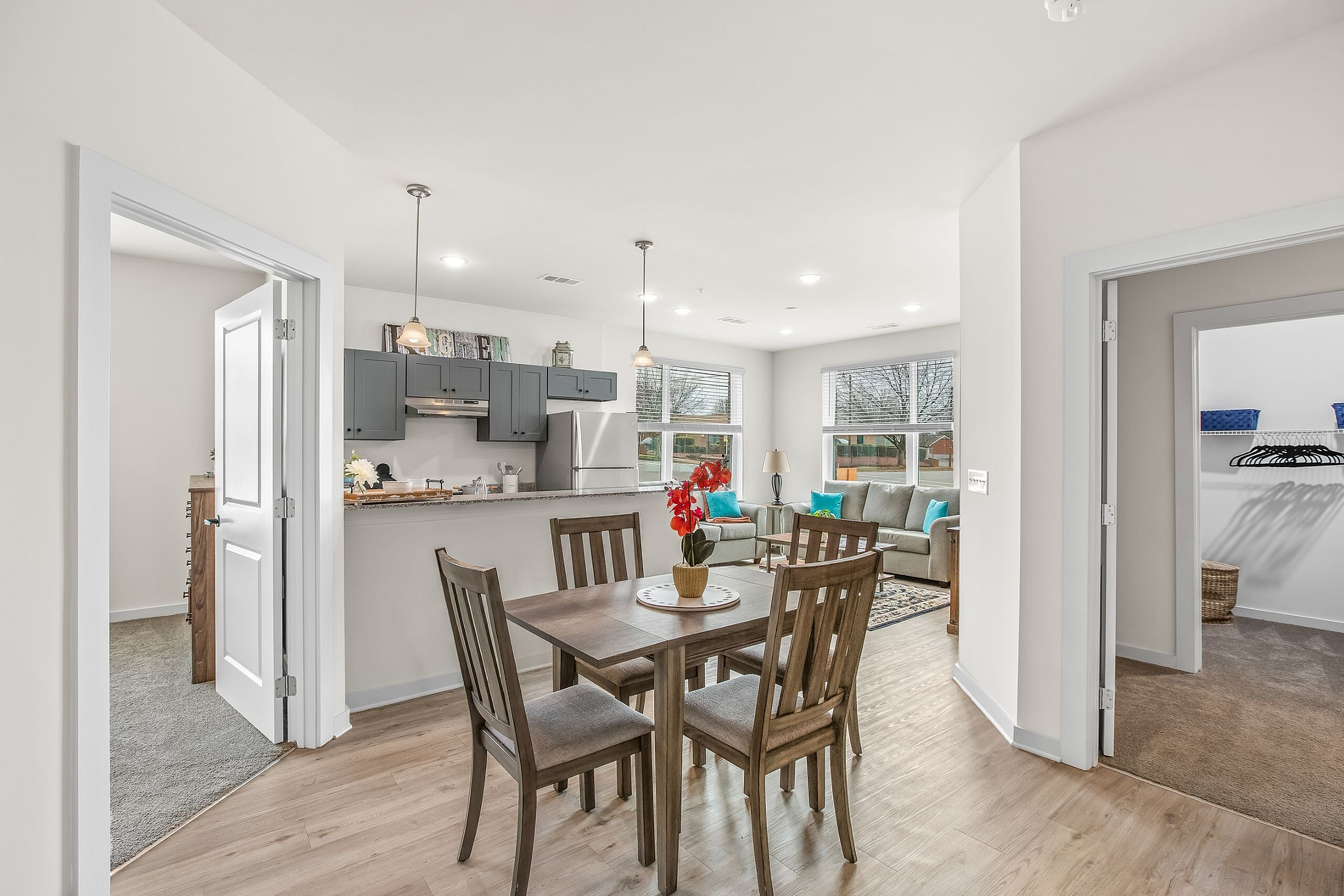 Inviting open-plan living space with a modern kitchen, vibrant dining area, and cozy seating, perfect for relaxation and entertainment.