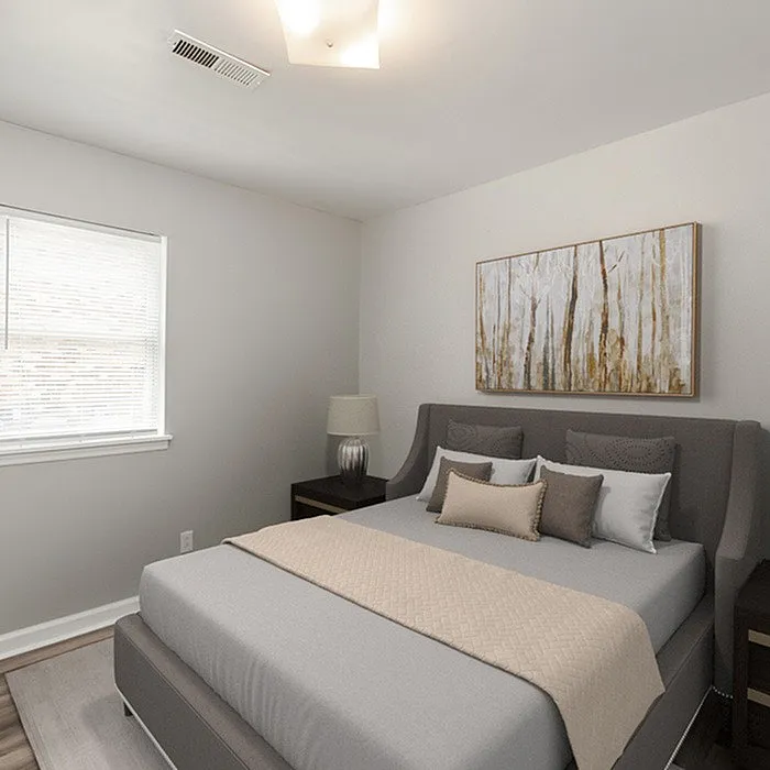 Elegant bedroom with a plush bed, modern furnishings, and calming wall art.