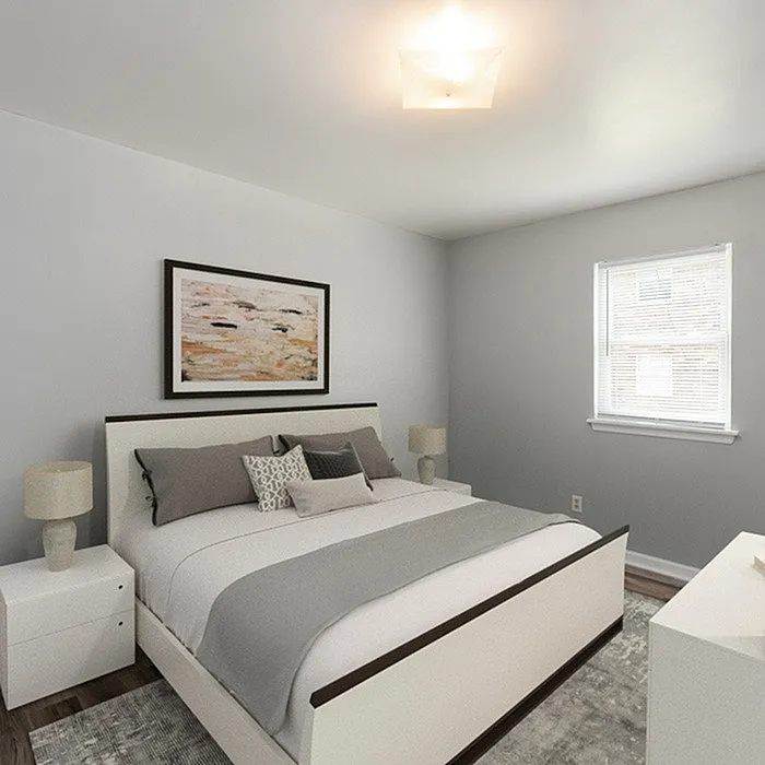 Cozy master bedroom with modern decor, featuring a plush bed and contemporary artwork.