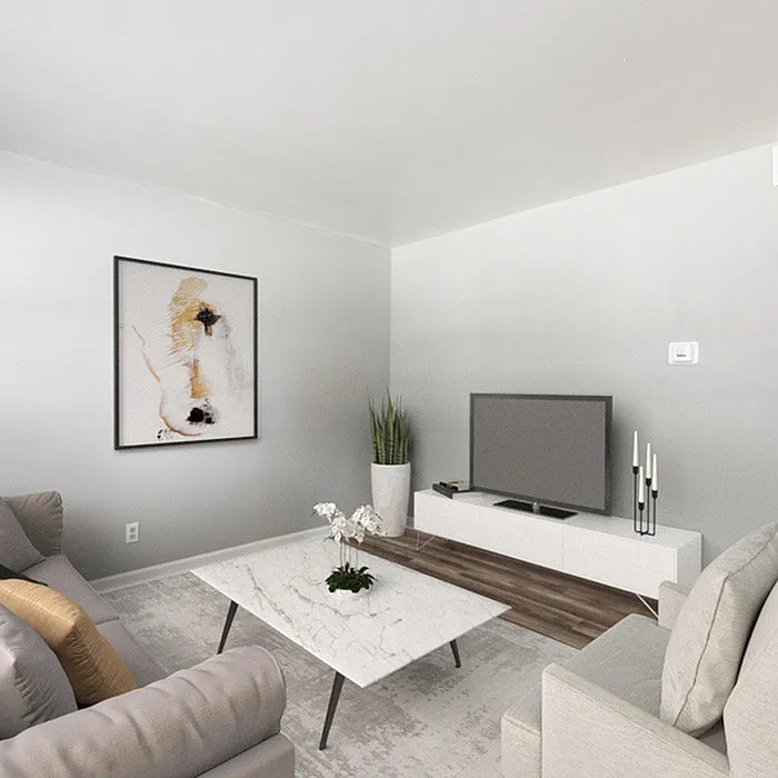 Elegant living room featuring modern furniture, a marble coffee table, and stylish decor.