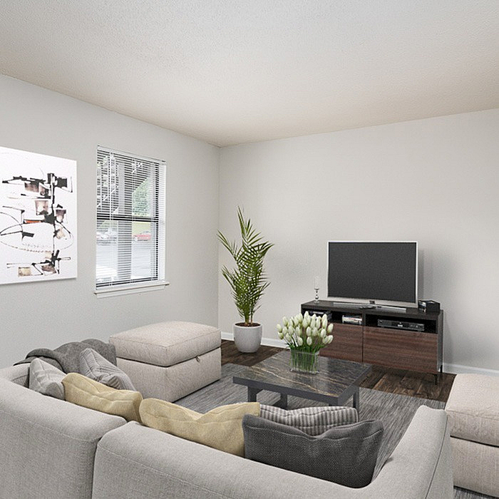 Inviting living room with modern decor, featuring a cozy sectional sofa, a sleek TV stand, and a potted plant enhancing the serene ambiance.