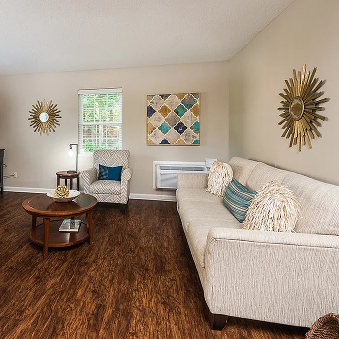 Inviting living room with stylish decor, cozy seating, and elegant hardwood floors, perfect for relaxation.