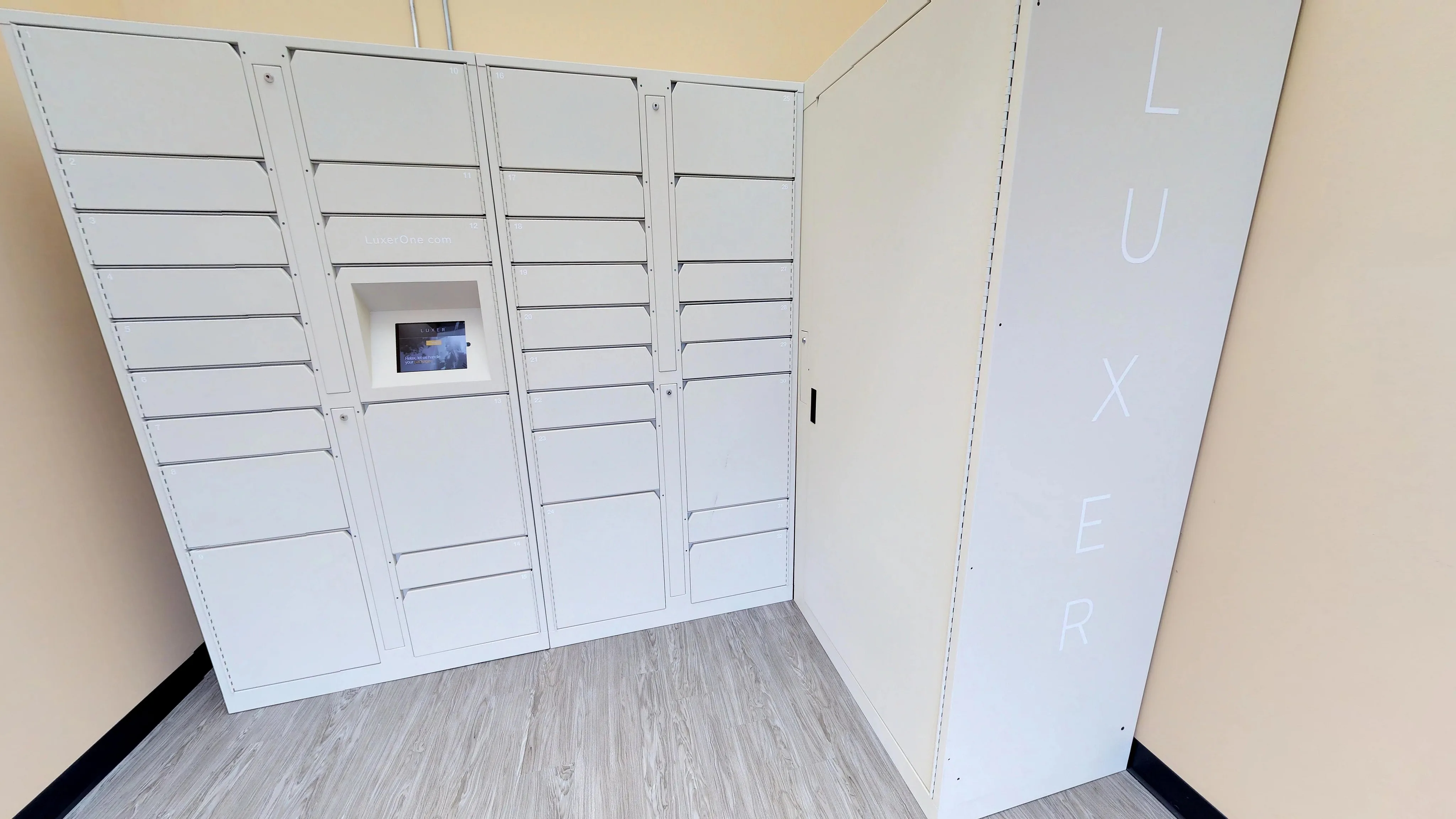 State-of-the-art package locker station with sleek white design, offering secure and convenient parcel storage.