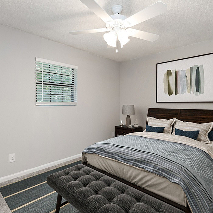 Inviting modern bedroom with elegant decor, featuring a cozy bed, stylish artwork, and a soothing color palette.