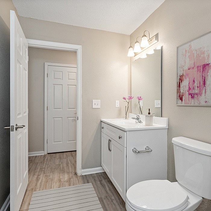 Modern bathroom with elegant vanity, stylish lighting, and tasteful decor, offering a serene and inviting atmosphere.