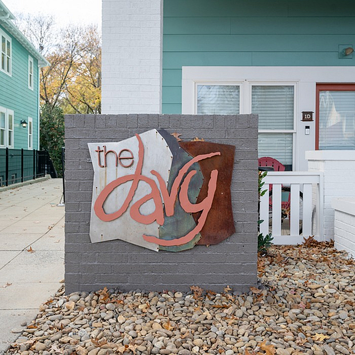 Charming apartment entrance featuring a stylish sign for 'The Davy' with modern design elements.