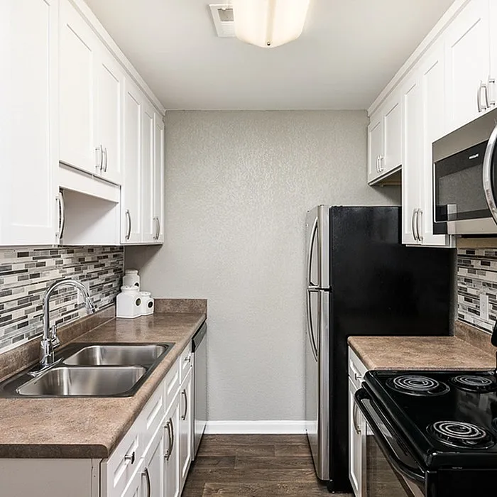Modern kitchen with sleek cabinets, stainless steel appliances, and stylish backsplash for a contemporary feel.