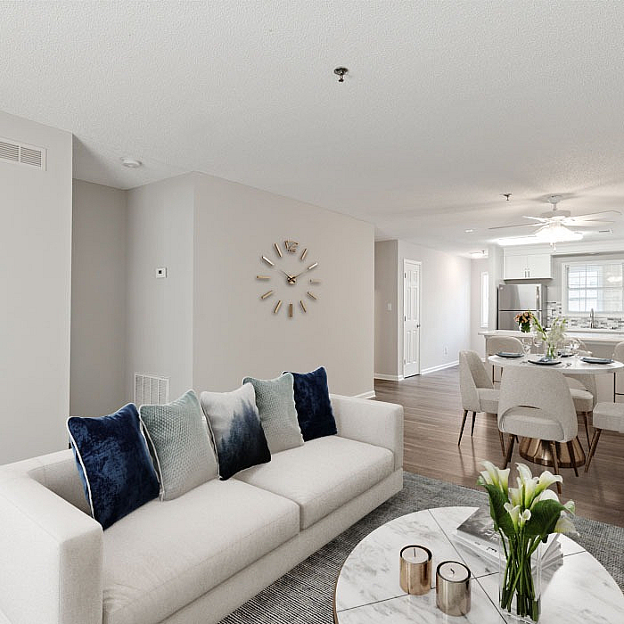 Elegant open-concept living space featuring a modern kitchen, sleek dining area, and cozy living room with stylish decor.