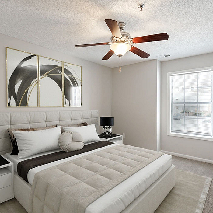 Bright and modern bedroom featuring a plush bed with elegant decor, large window for natural light, and ceiling fan for comfort.