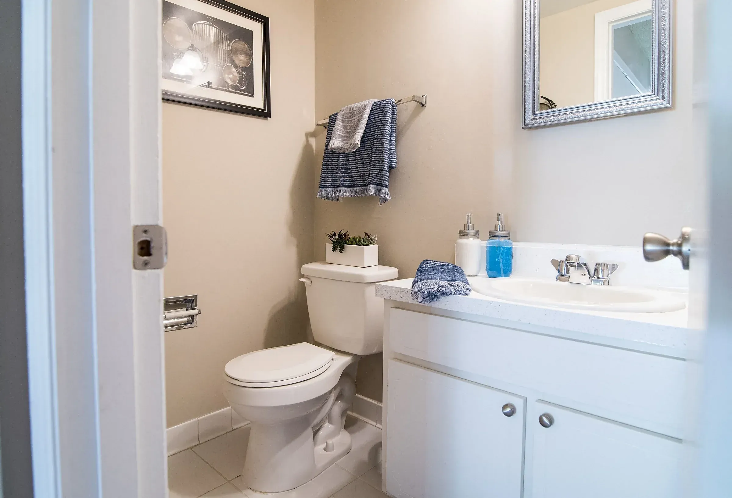 Modern half bathroom with sink and toilet