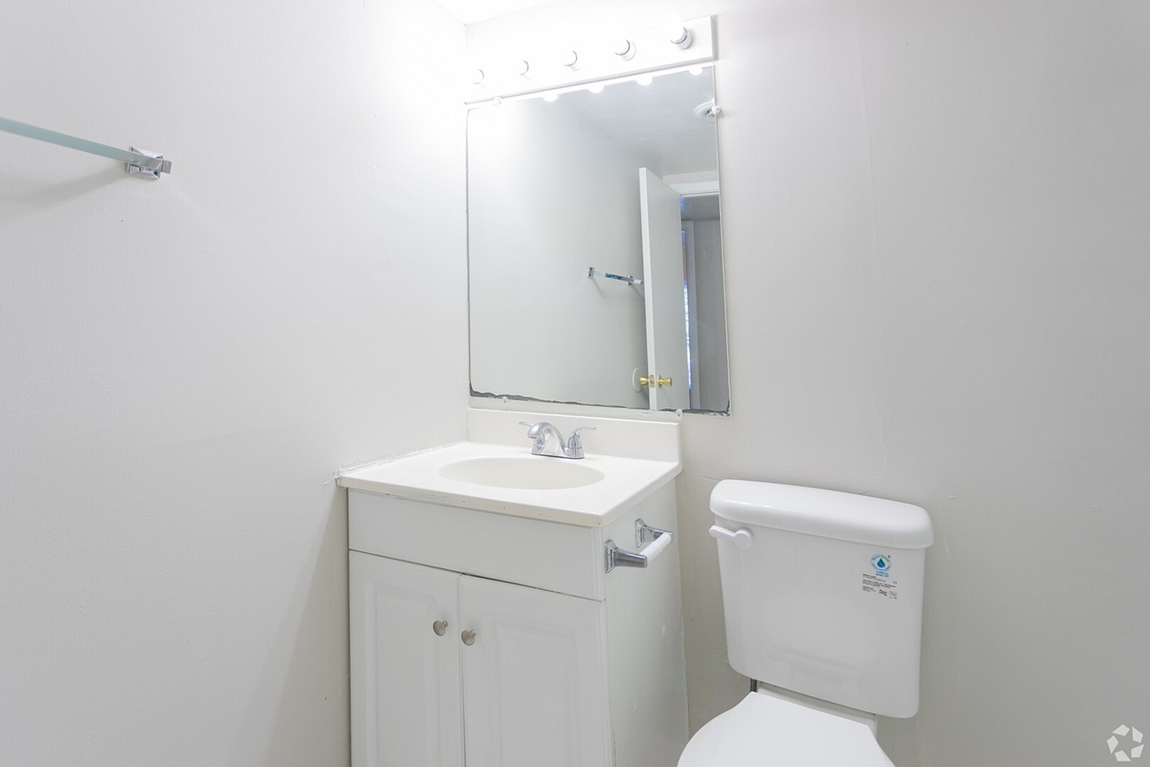 Bright and clean bathroom with white vanity and modern fixtures, perfect for a fresh start to your day.