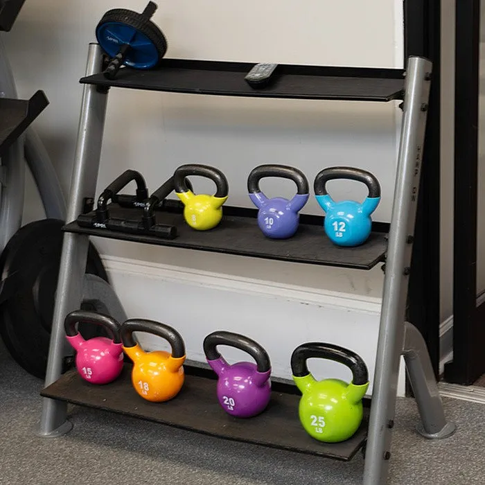 Modern fitness corner with a sleek kettlebell rack showcasing a vibrant collection of weights for a dynamic workout space.