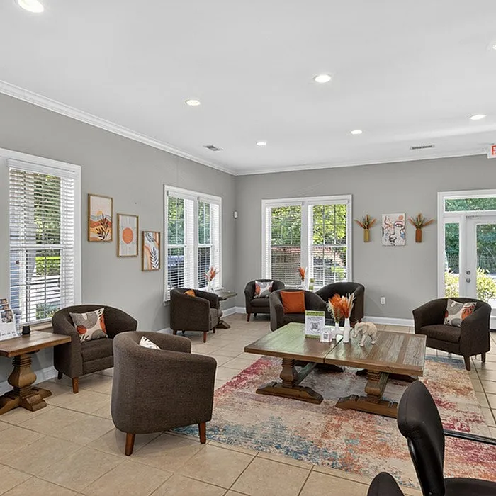 Charming communal lounge with stylish seating, modern decor, and abundant natural light, creating a welcoming atmosphere.