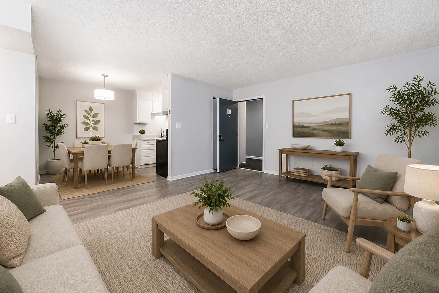 Inviting open-concept living and dining area with cozy neutral tones, elegant decor, and abundant natural light.