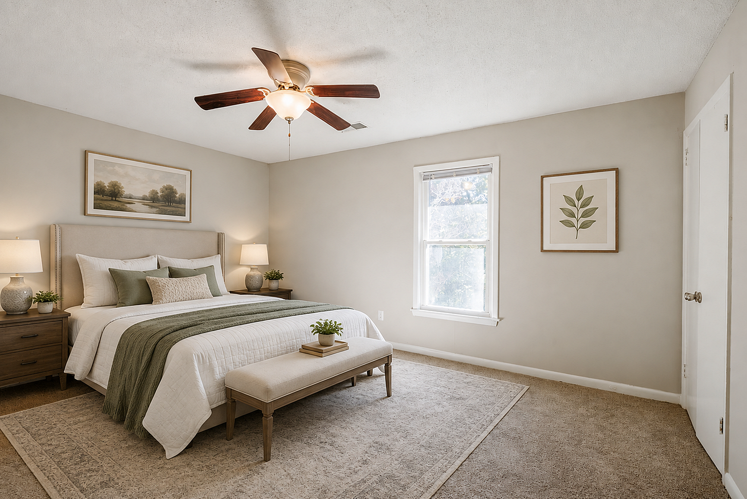 Elegant and cozy bedroom with a plush bed, stylish decor, and natural light streaming through a large window.