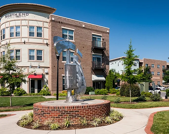 Vibrant apartment complex with modern architecture and landscaped surroundings.