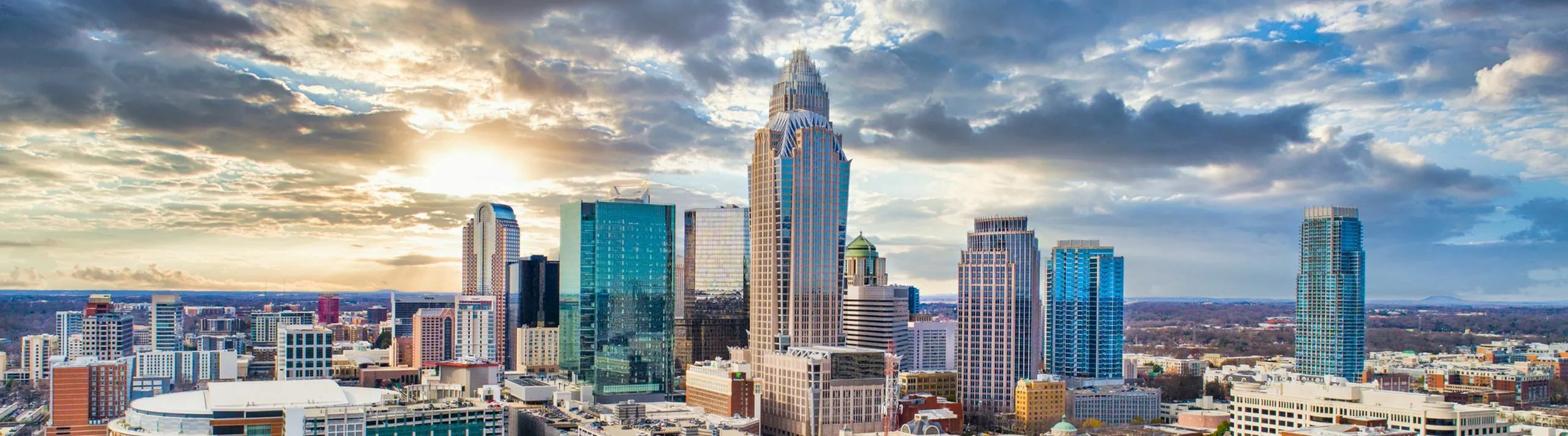 Breathtaking cityscape featuring modern skyscrapers under a dramatic sky, showcasing vibrant urban living.