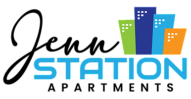 Vibrant Station Realty logo featuring colorful skyscraper icons and bold text.
