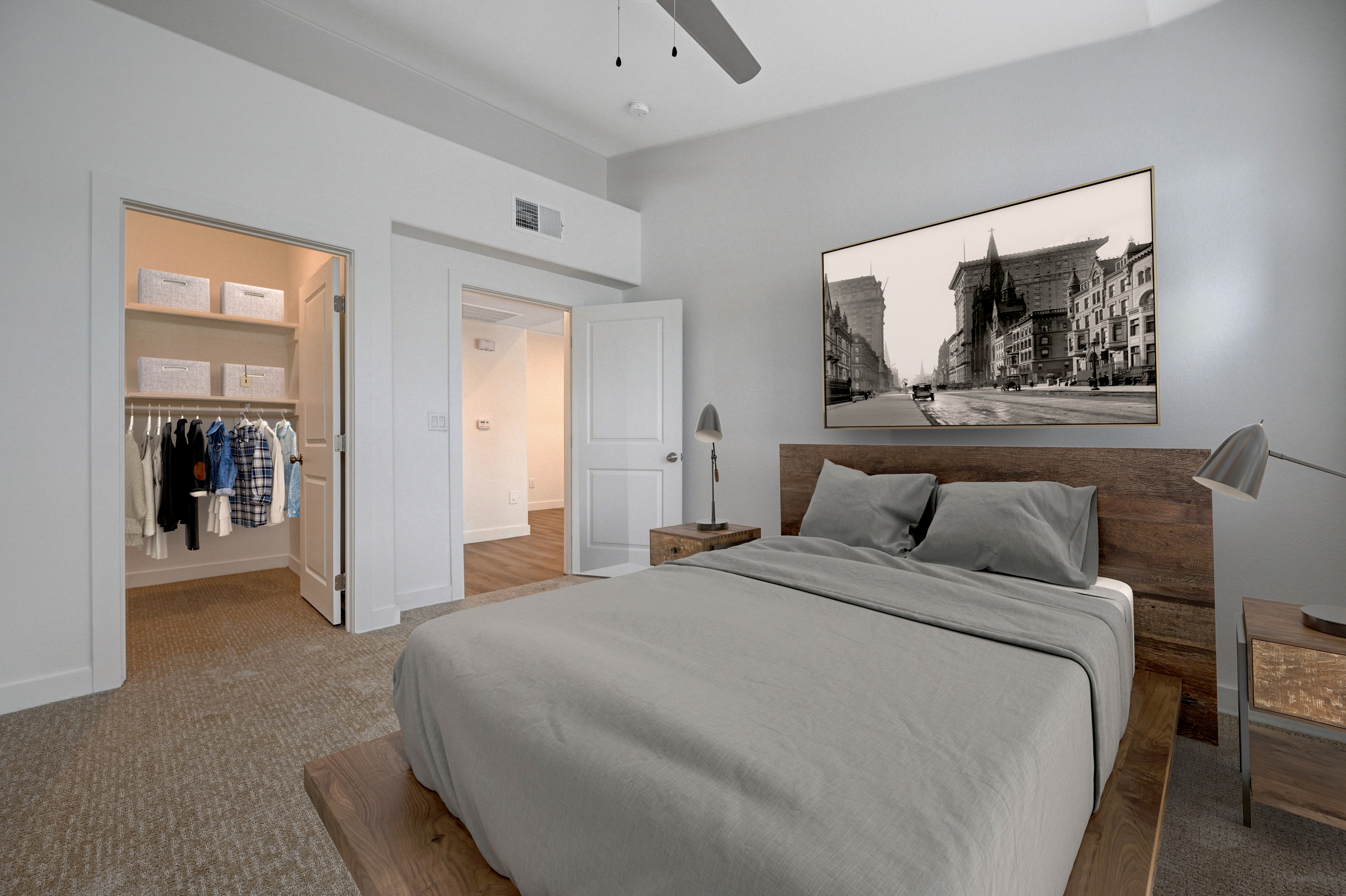 Inviting bedroom with modern decor, featuring a cozy bed, stylish nightstands, and a spacious walk-in closet.