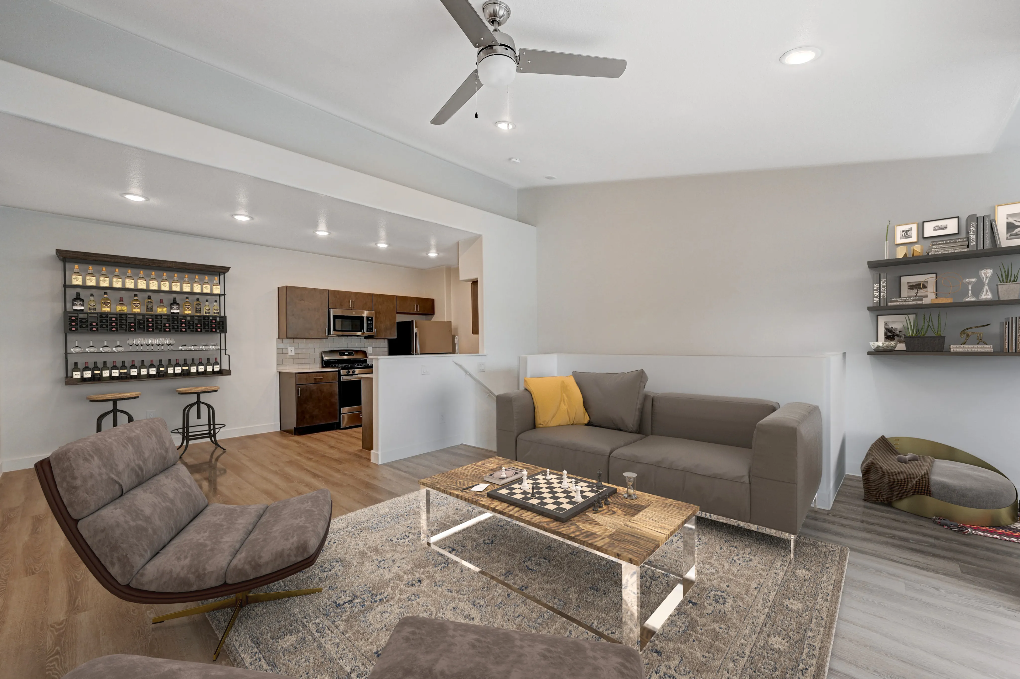 Contemporary living room with sleek open-plan kitchen, stylish furniture, and elegant bar featuring striking ceiling lighting.