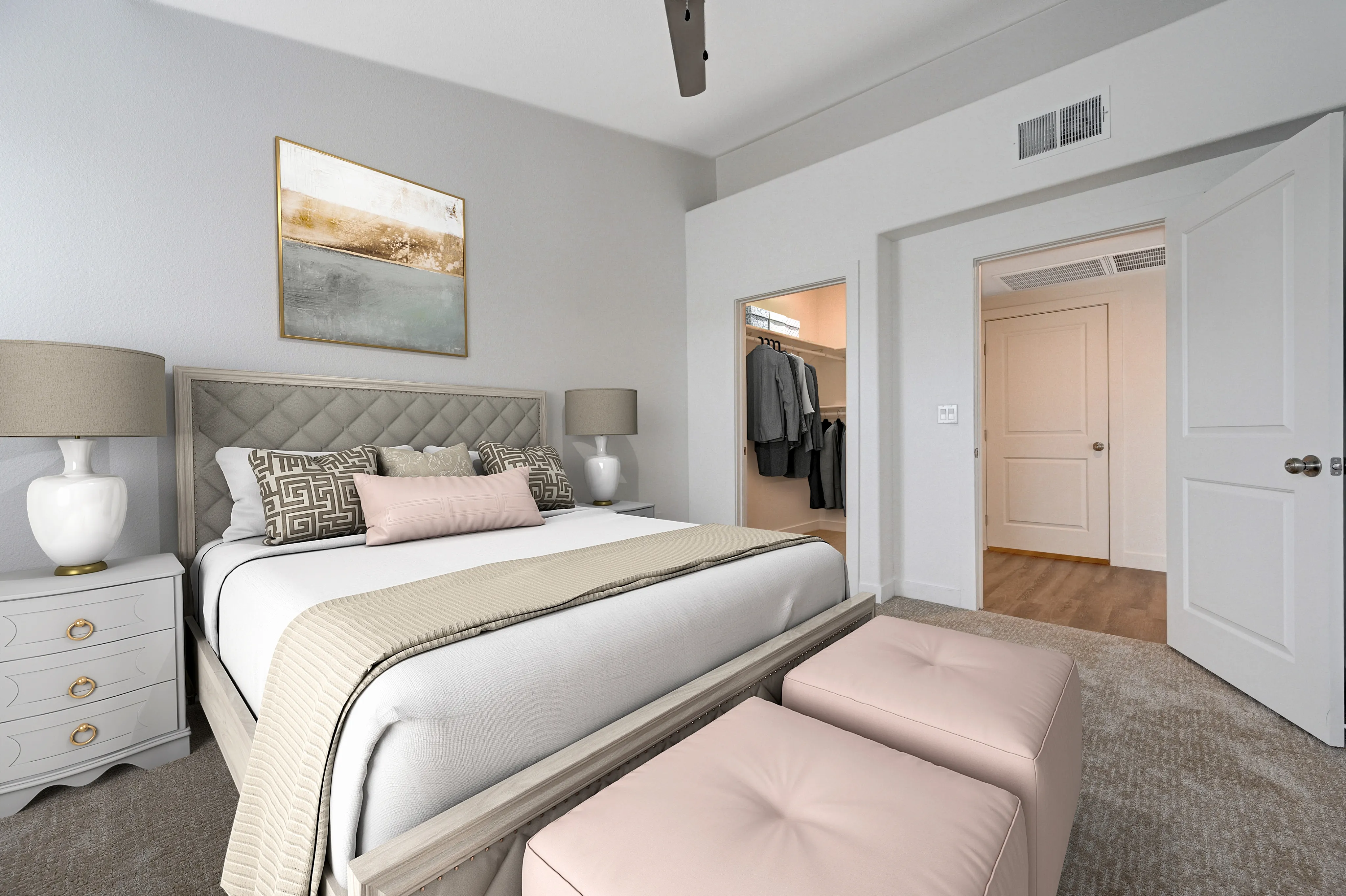 Elegant bedroom featuring a plush bed with stylish cushions, chic nightstands, and a spacious walk-in closet.