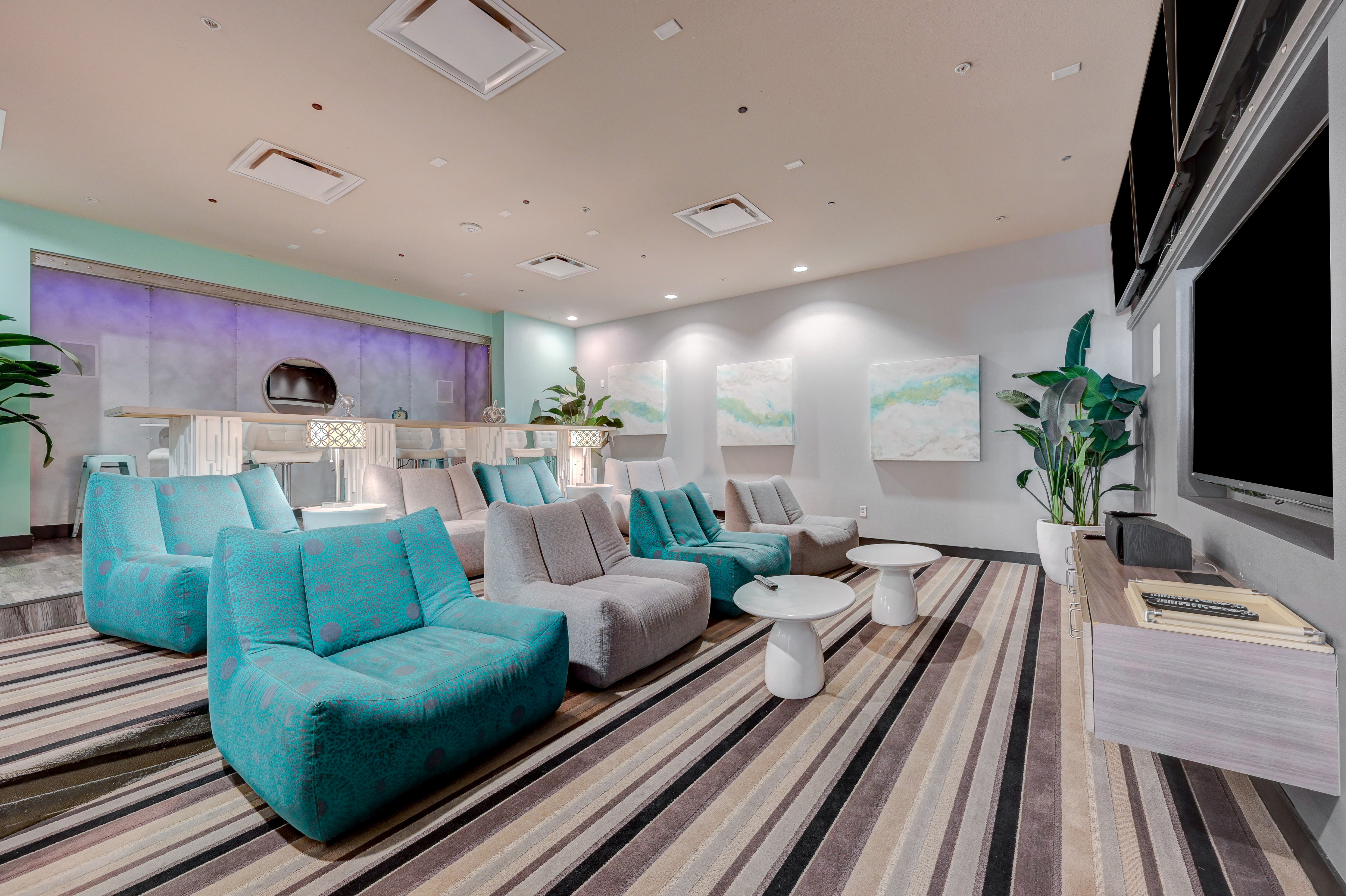 Modern communal lounge area featuring stylish seating and vibrant decor, perfect for relaxation and social gatherings.