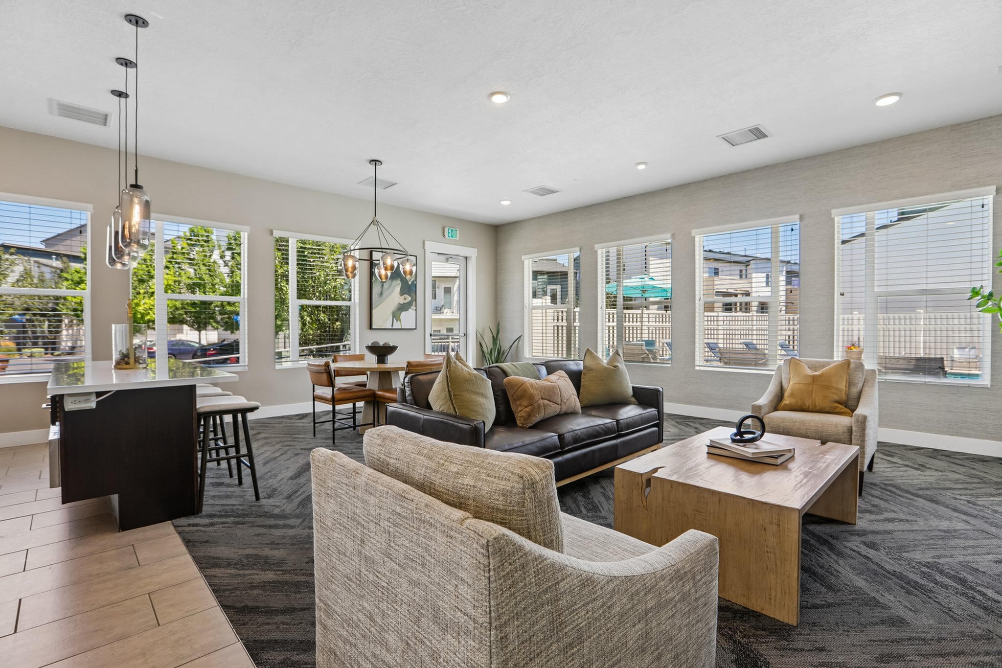 Elegant and modern living room with natural light, comfortable seating, and stylish decor, perfect for relaxation and entertaining.