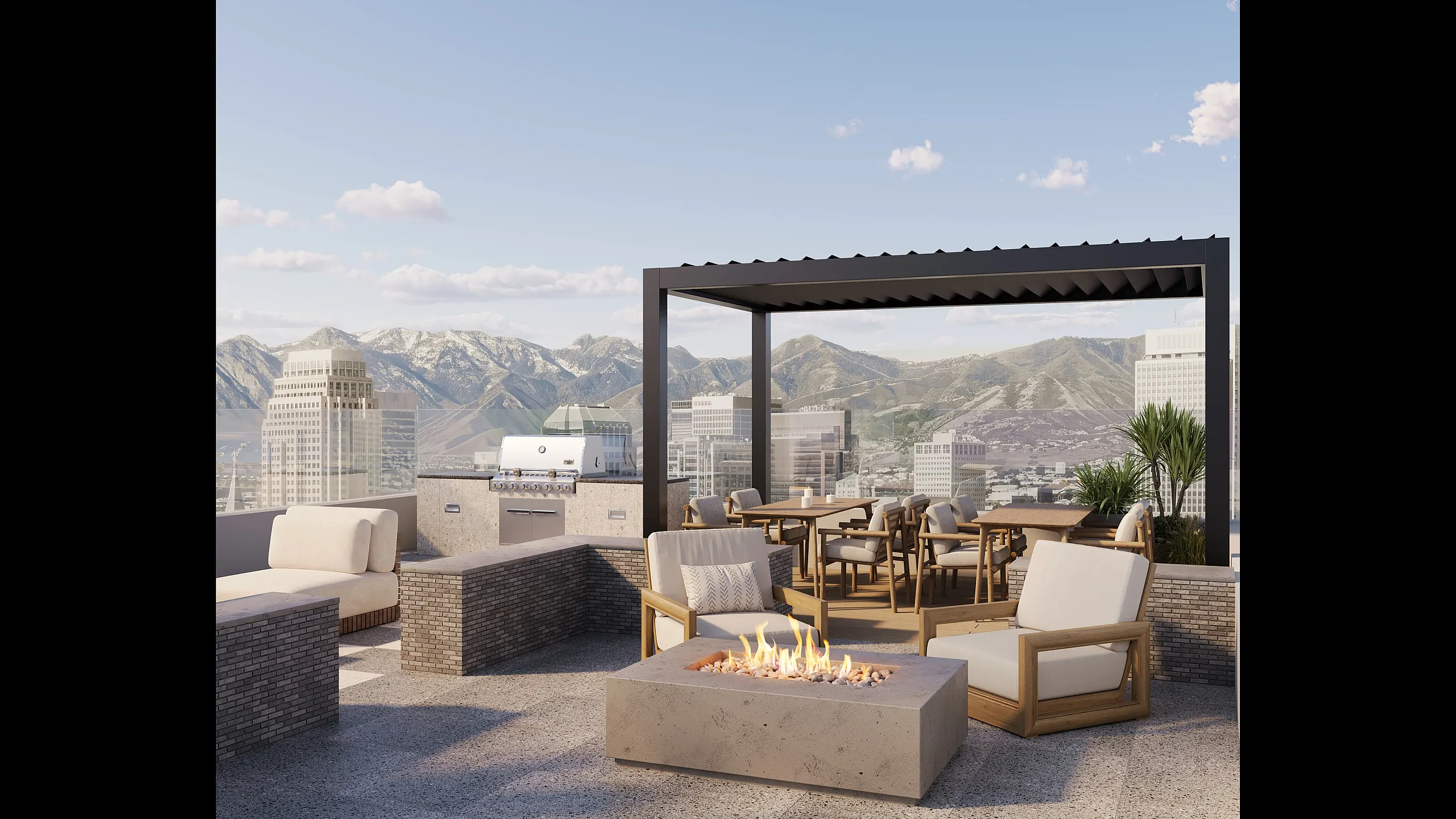 Luxurious rooftop patio with fire pit and grill, offering breathtaking city and mountain views.