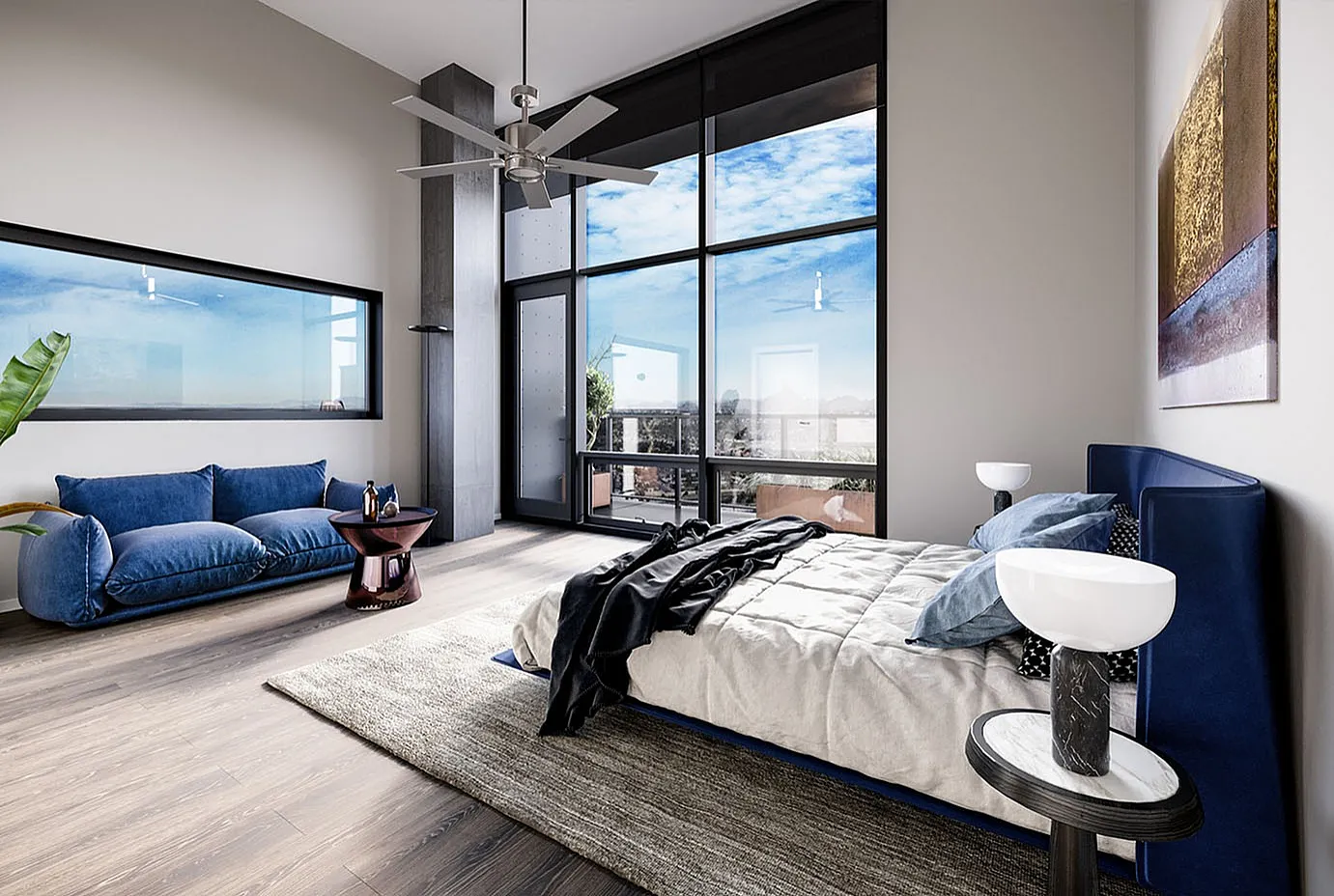 Luxurious modern bedroom featuring floor-to-ceiling windows with breathtaking city views, elegant blue sofa, and stylish decor.