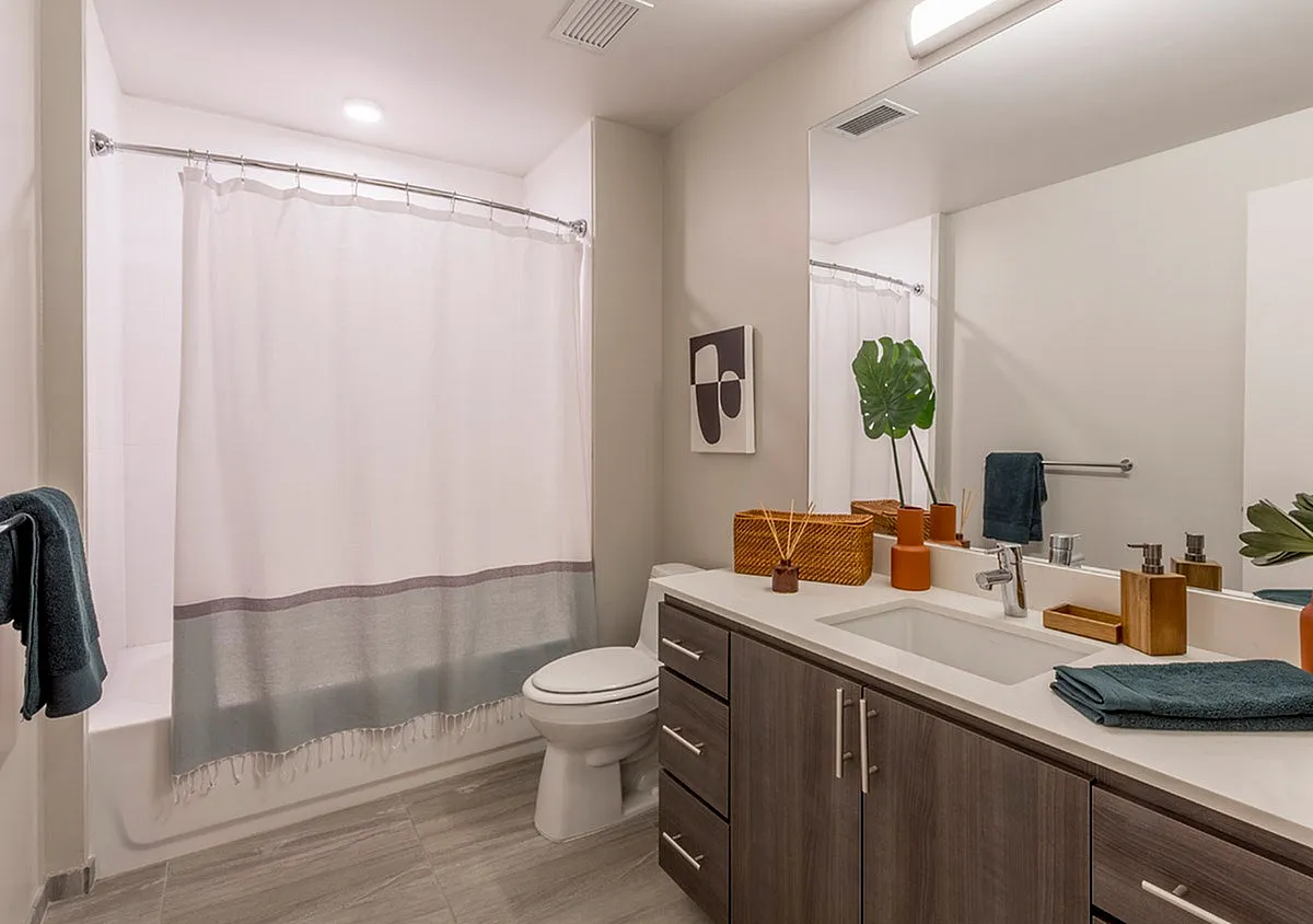 Modern bathroom oasis with sleek cabinetry, elegant vanity, and stylish decor accents.