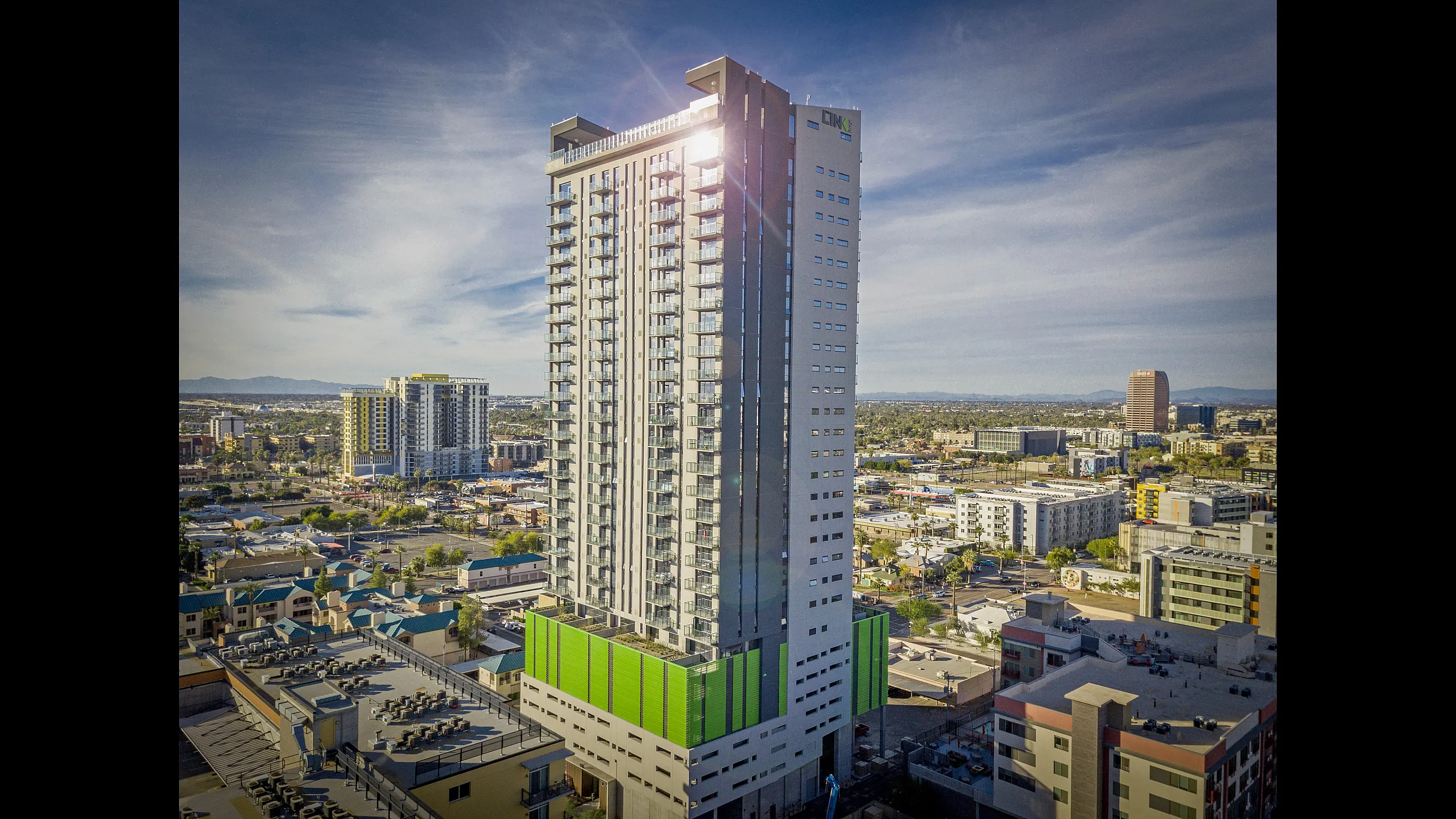 Stunning high-rise apartment building with modern architecture and panoramic city views, ideal for urban living.