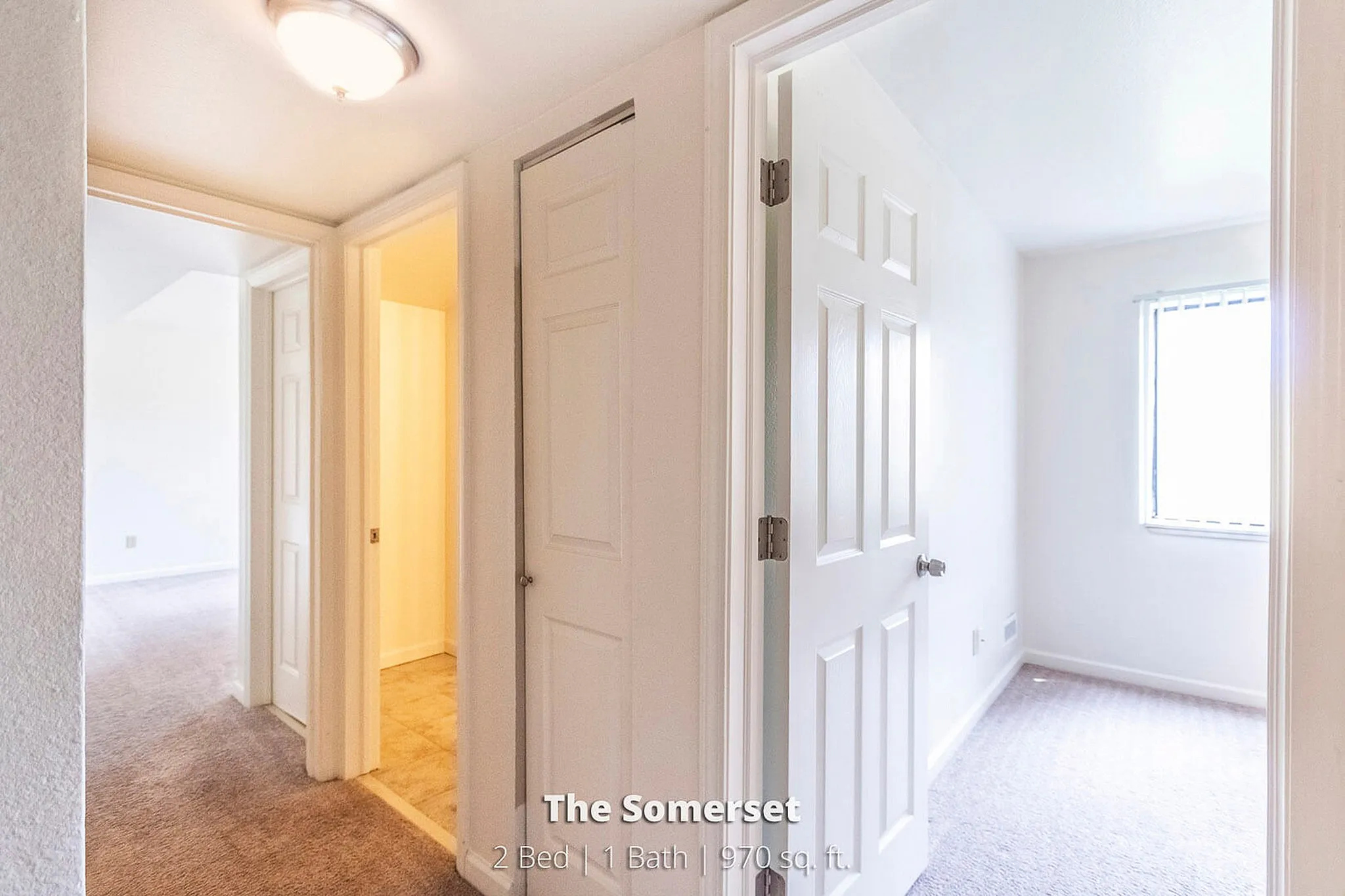 Bright hallway view in The Somerset apartment featuring 2 bedrooms, 1 bath, and 970 sq. ft. of elegant living space.