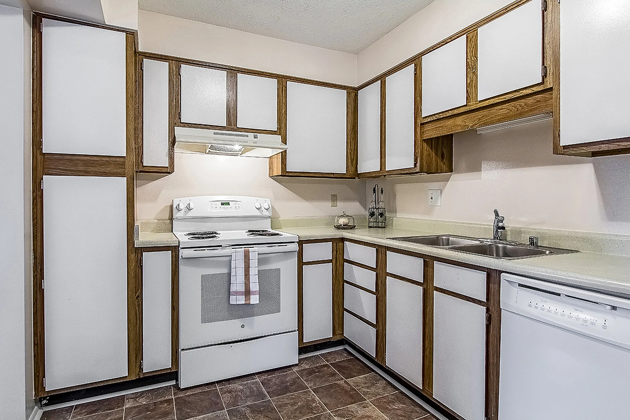 Charming kitchen with sleek cabinetry and modern appliances, perfect for culinary creations.
