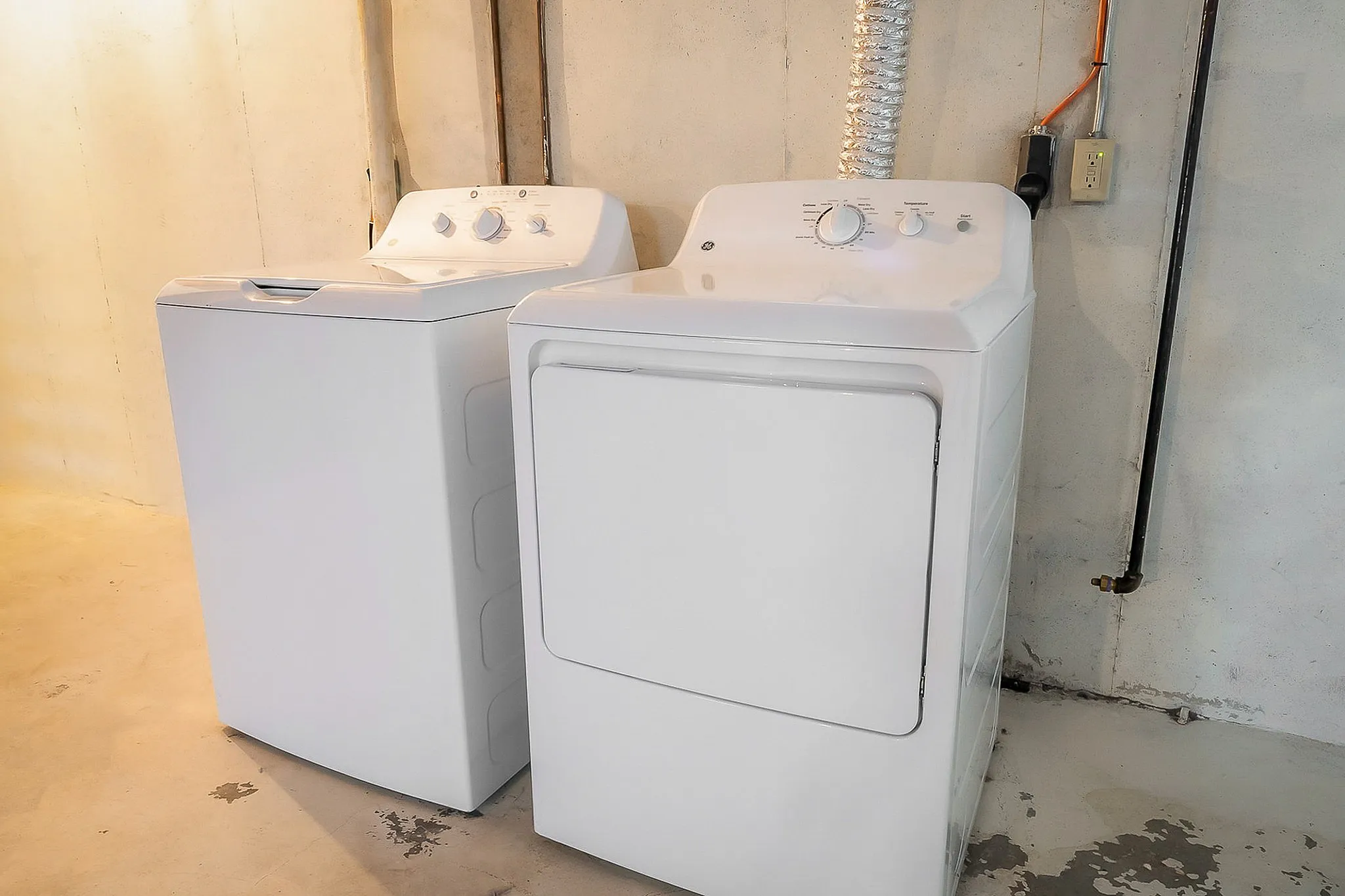 Modern laundry area featuring sleek washer and dryer set, perfect for convenient in-home laundering.