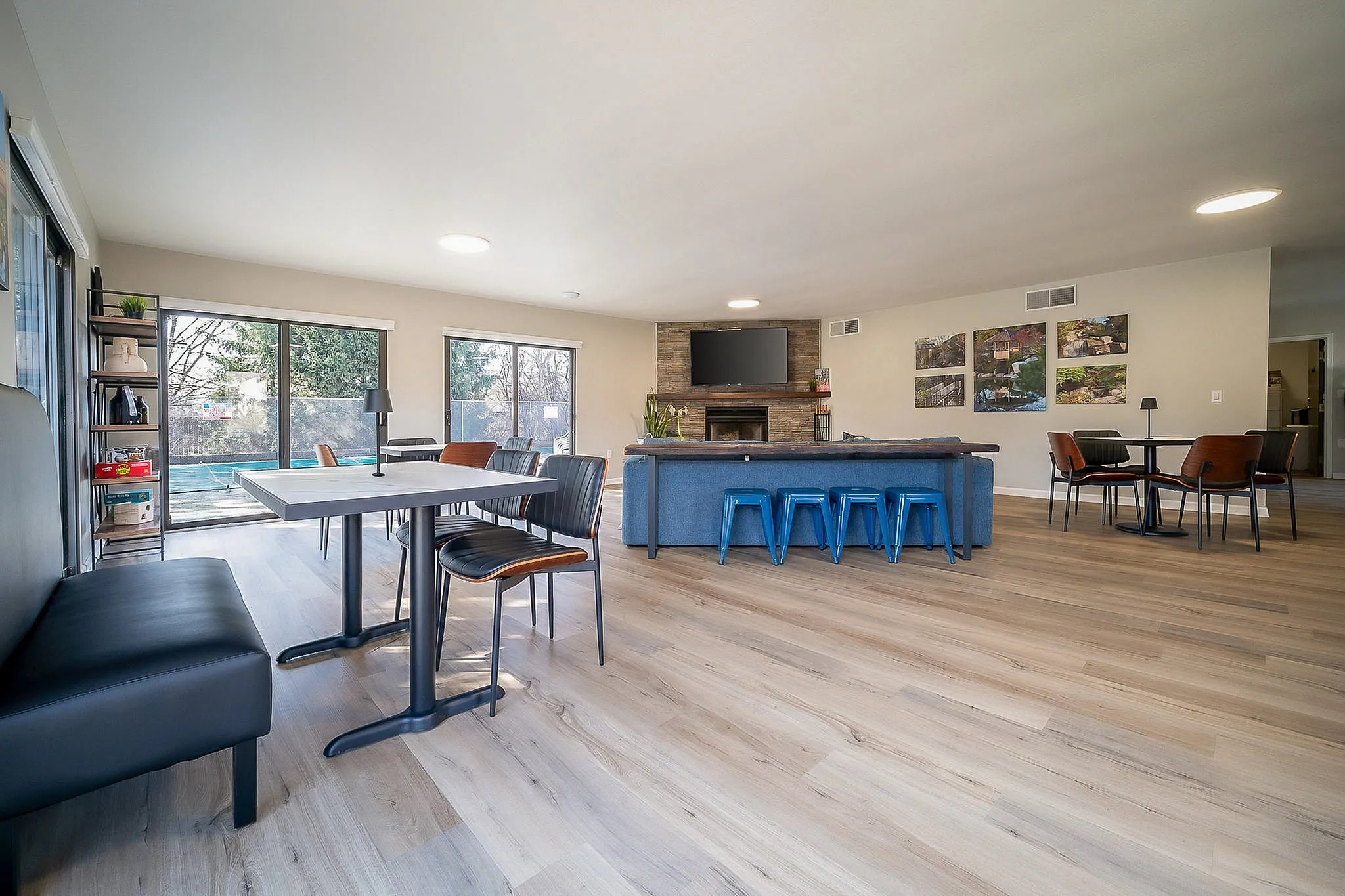 Bright and inviting living space with modern dining areas, cozy seating, and large windows for natural light.