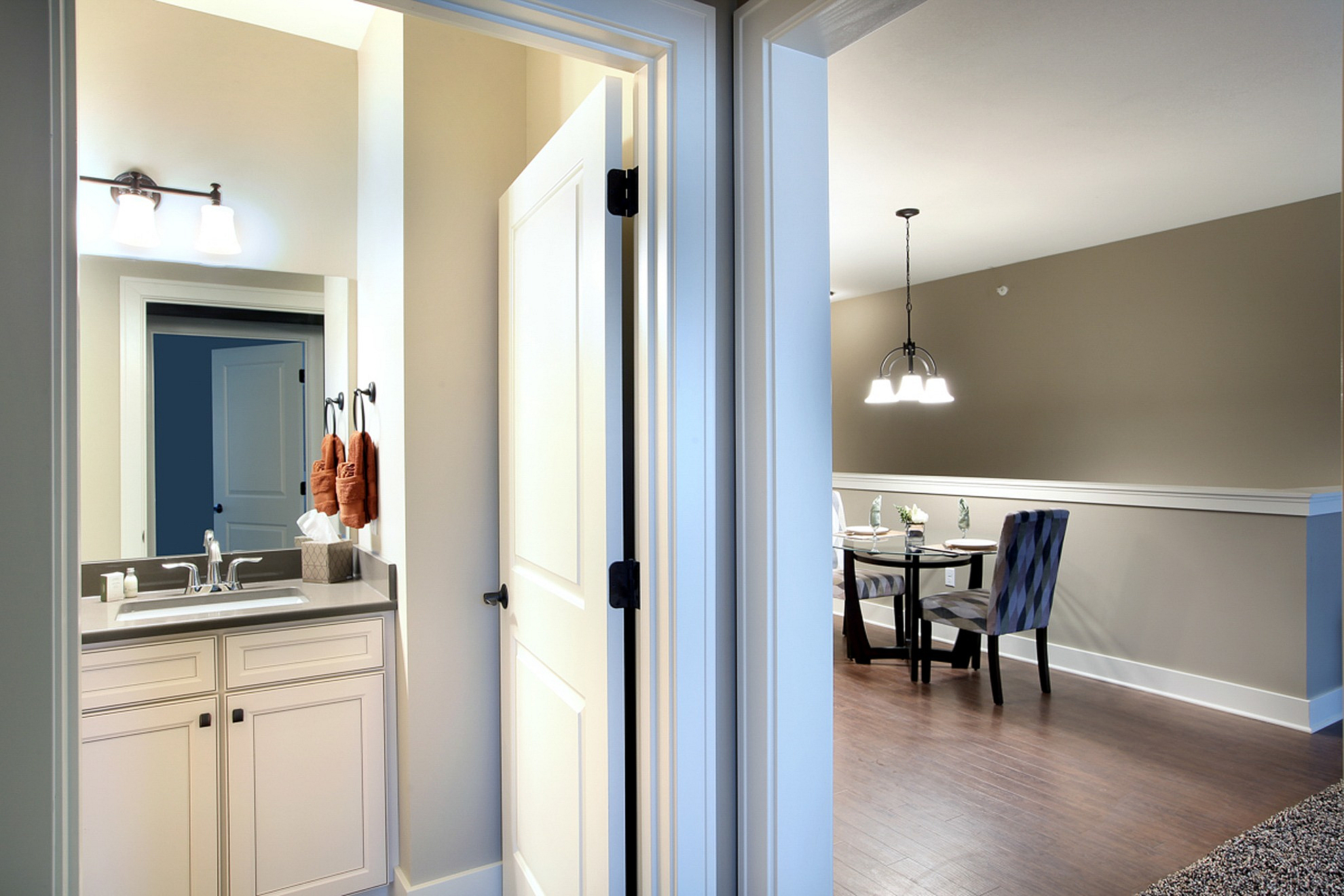 Elegant modern apartment with a stylish bathroom and cozy dining area, perfect for contemporary living.