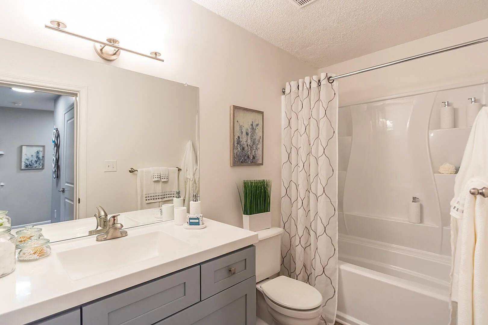 Elegant bathroom featuring sleek fixtures, a modern vanity, and stylish decor for a refreshing ambiance.