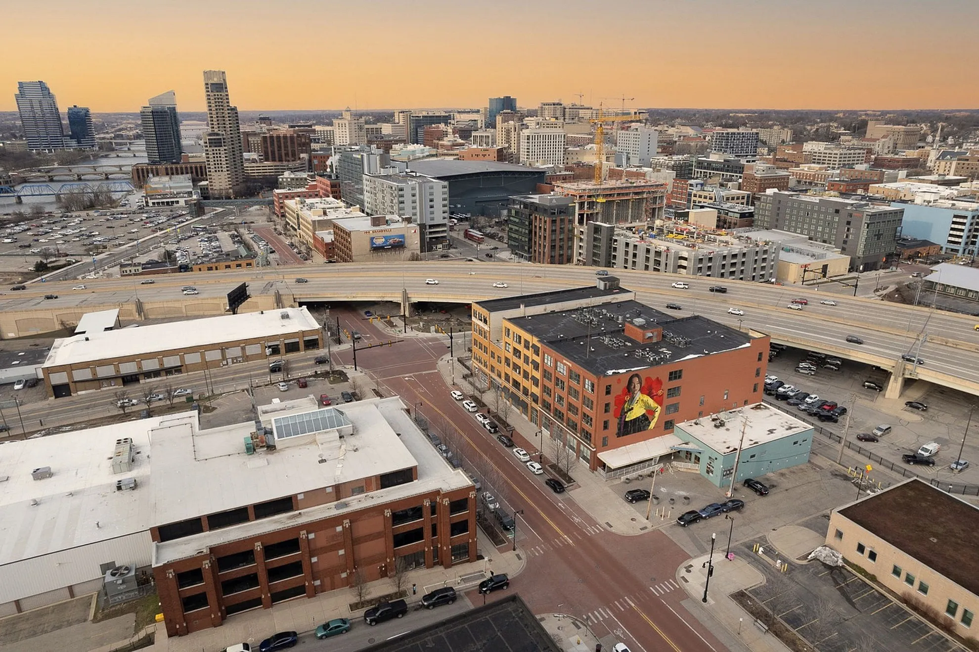 Panoramic cityscape view at sunset showcasing a bustling urban skyline with impressive high-rises and modern architecture.