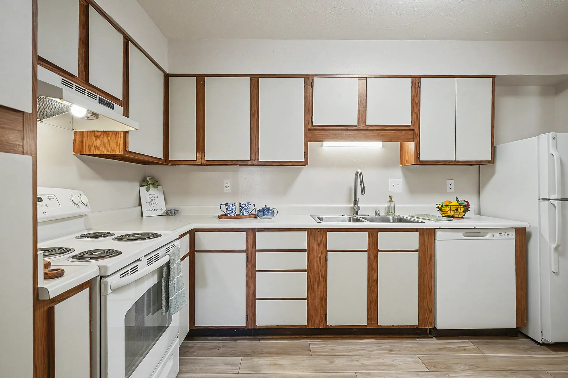 Charming kitchen with sleek countertops, modern appliances, and a well-organized layout, perfect for culinary enthusiasts.