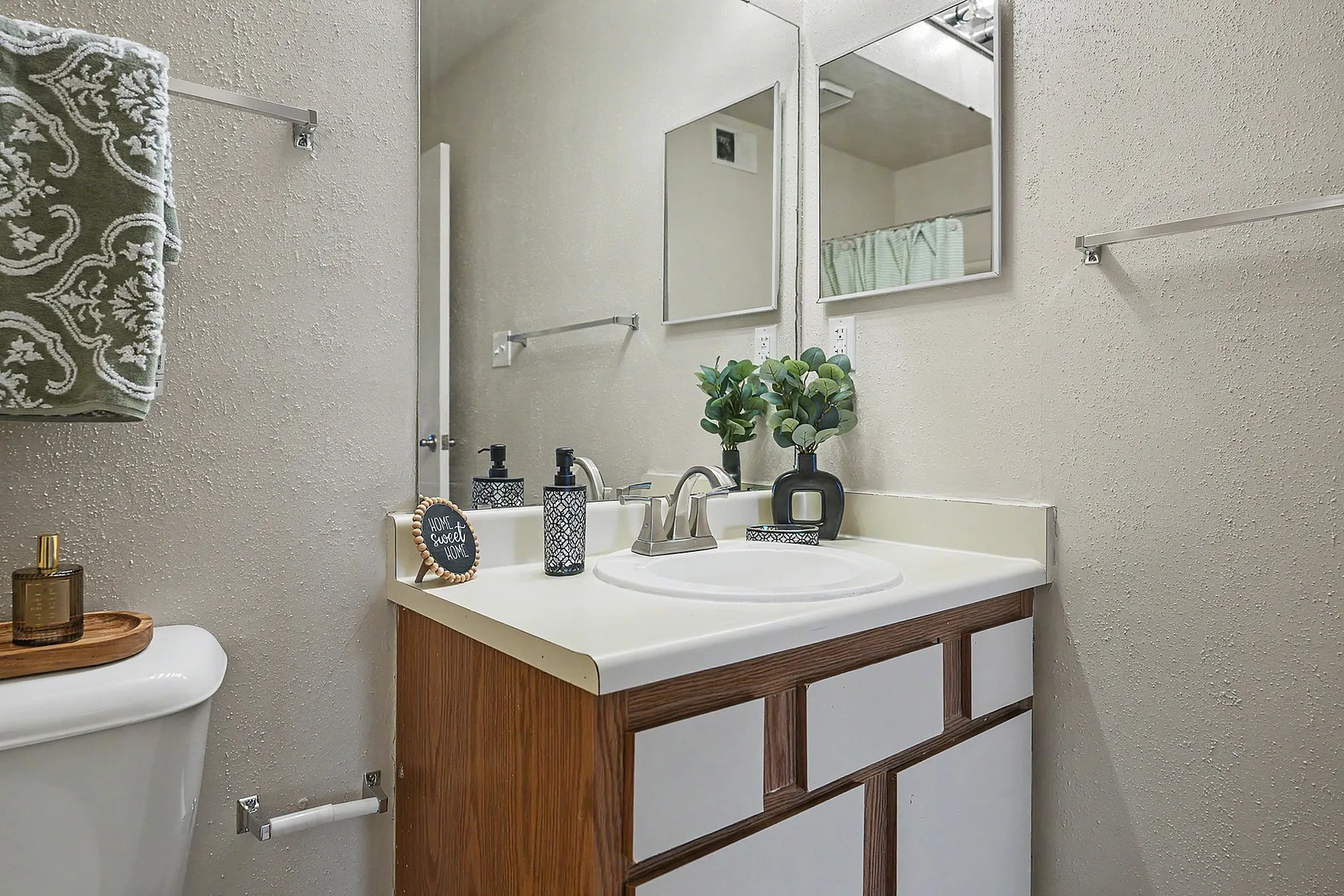 Inviting bathroom with modern fixtures, stylish vanity, and decorative accents.