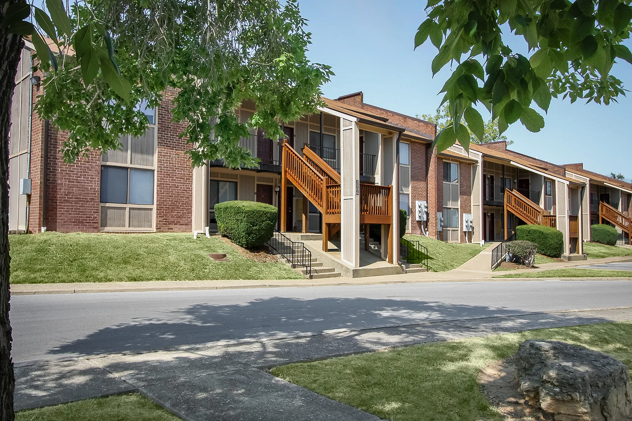 Charming apartment complex with picturesque balconies and lush greenery, perfect for a tranquil lifestyle.