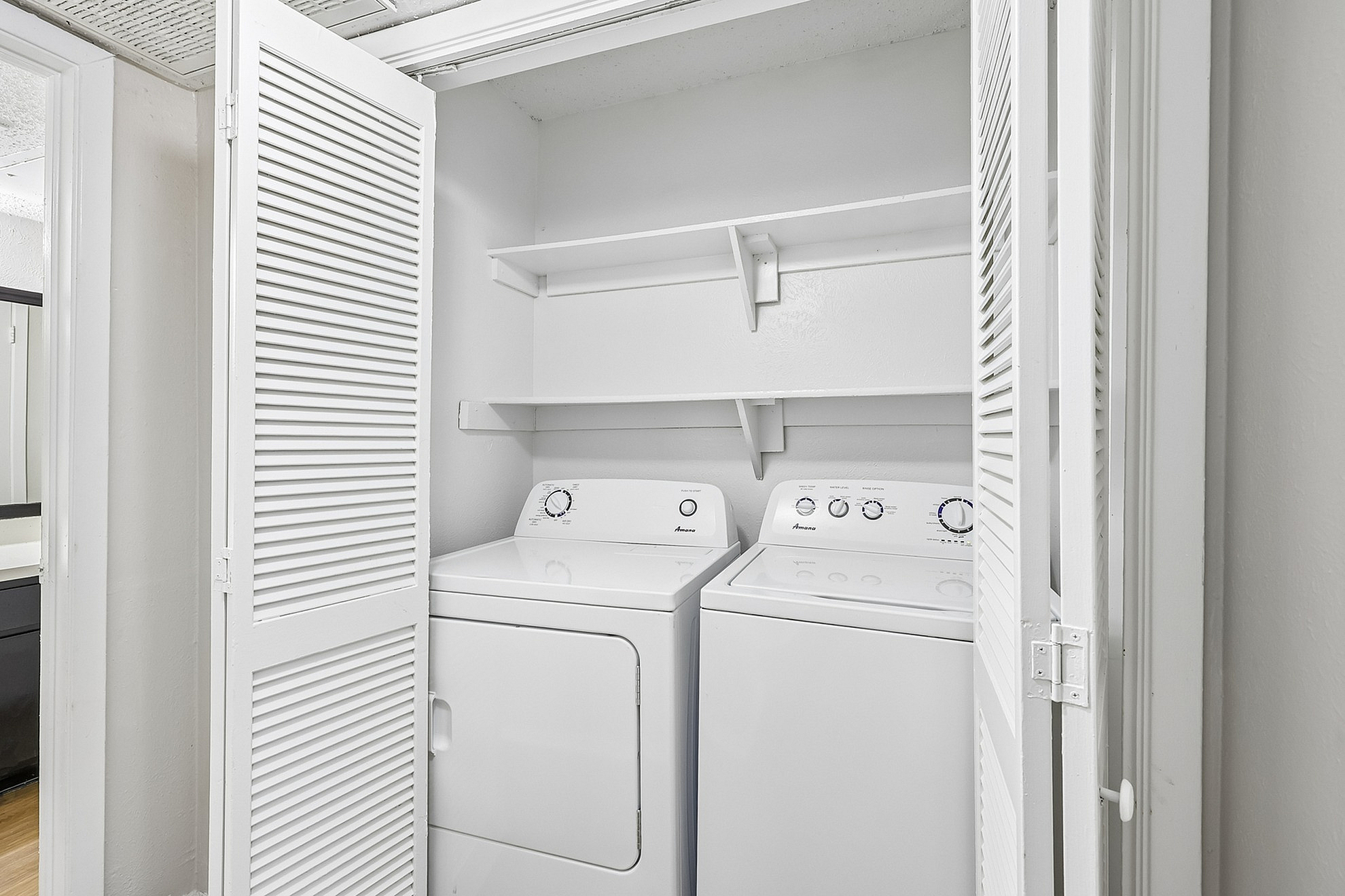 Convenient in-unit laundry area with washer and dryer, enhancing modern living.