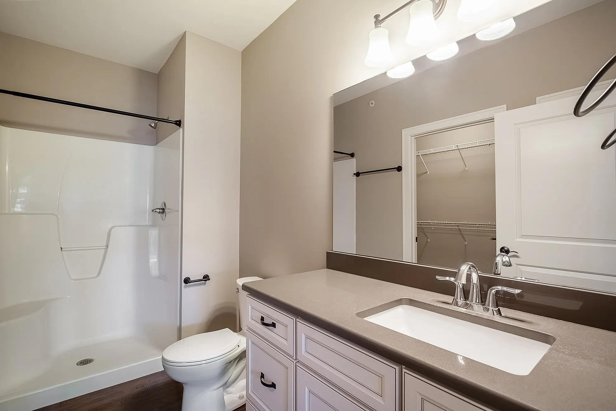 Modern and elegant bathroom with sleek fixtures, stylish vanity, and spacious shower, perfect for relaxation.
